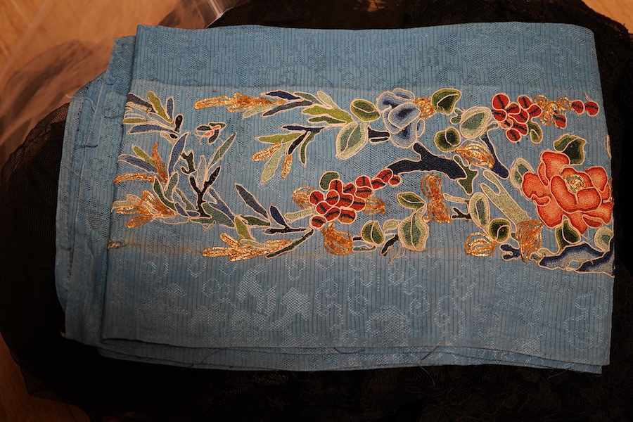 A pair of Chinese silk embroidered sleeve bands and a small collection of black lace stoles, etc.